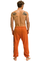 Retro UNIVERSITY OF TEXAS UNISEX CIRCLE PRINT SWEATPANTS - BURNT ORANGE