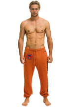 Retro UNIVERSITY OF TEXAS UNISEX CIRCLE PRINT SWEATPANTS - BURNT ORANGE